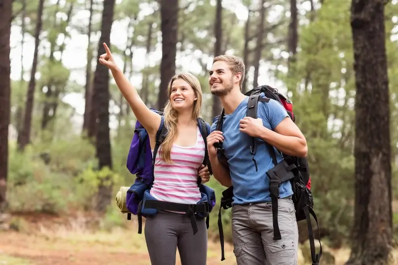Active couple hiking outdoors after recovery