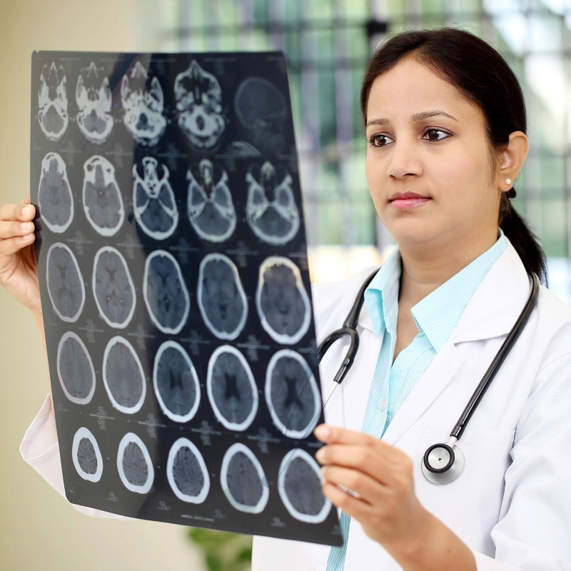 Medical provider reviewing diagnostic imaging scans